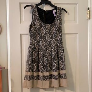 Francesca’s tan and black lace dress